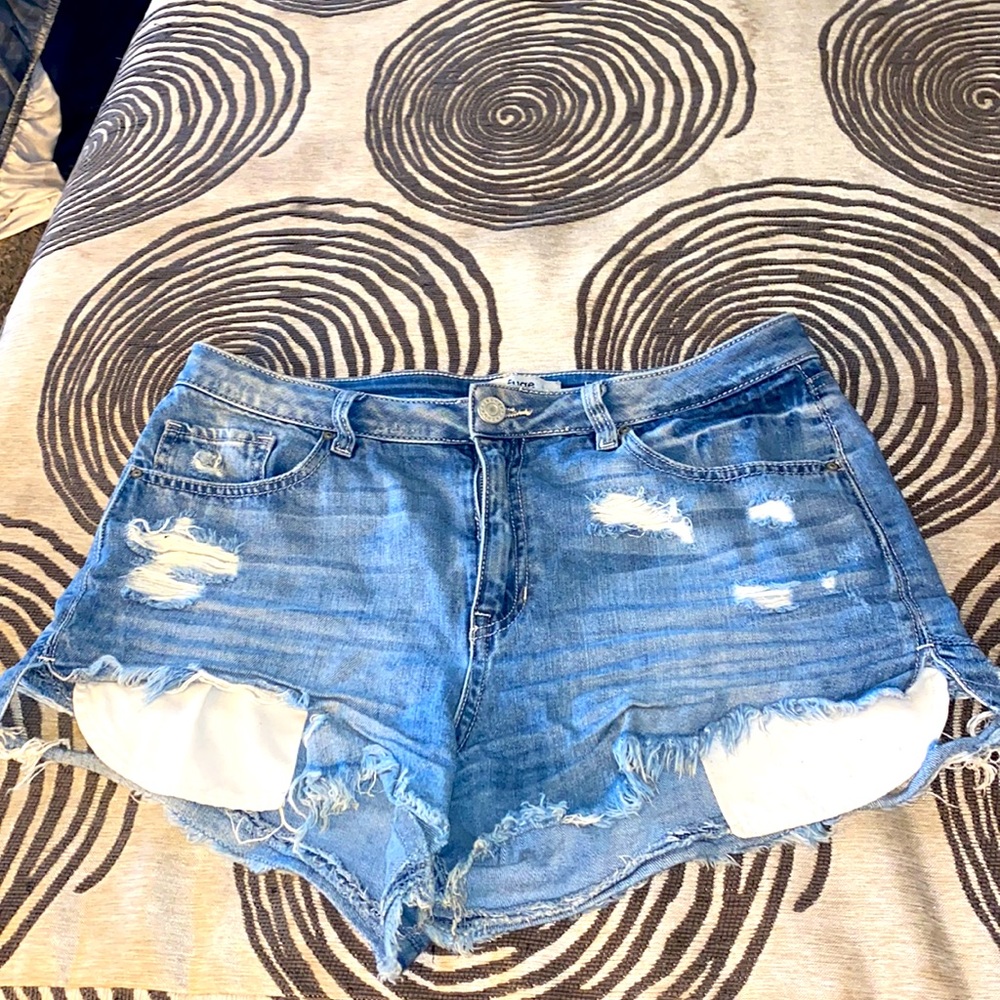 Jean shorts w/ rips on front and two on back